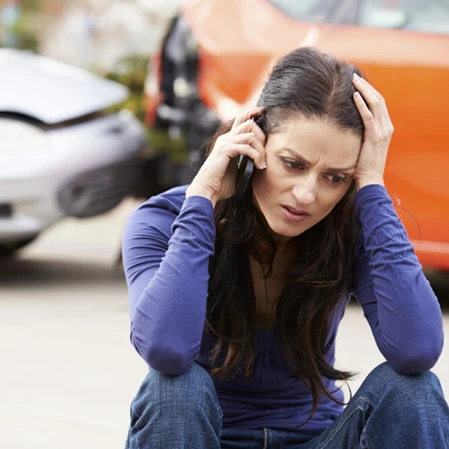 Woman On the Phone After an Accident and Auto Injury